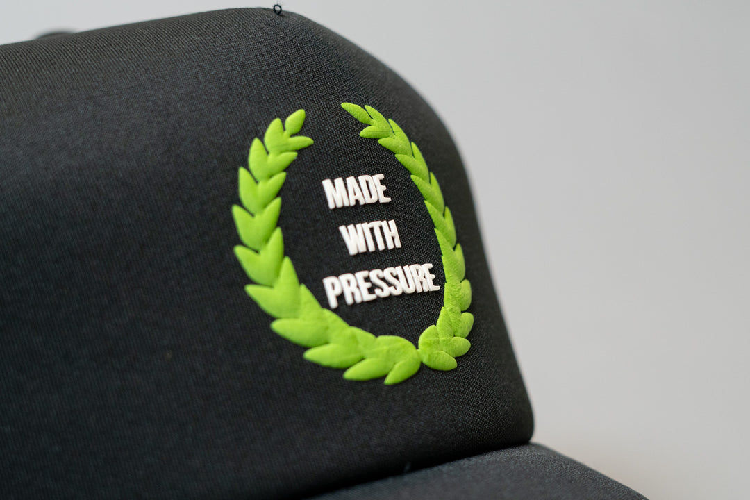 Made With Pressure Trucker Hat By Millionaire Champs™